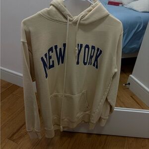 Brandy Melville Cream Hoodie with Blue New York Print